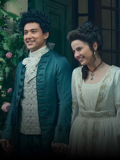 Will Sharpe as Wolfgang Amadeus Mozart and Gabrielle Creevy as Constanze Mozart standing holding hands